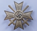 A War Merit Cross First Class with Swords marked 1 maker Deschler & Sohn, München.