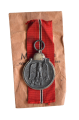 A 1941 - 42 EAST MEDAL marked 65 with paper bag maker Klein & Quenzer, Idar-Oberstein.