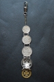 A 1915 COMMEMORATIVE CROSS & BONES WATCH FOB.