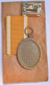 A West Wall Campaign Medal with ribbon and enwelope maker Karl Hensler, Pforzheim.