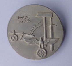 A 1936 National Day of Labour Badge maker marked.