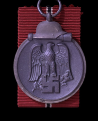 A 1941 - 42 EAST MEDAL MARKED 110 BY maker Otto Zappe, Gablonz.