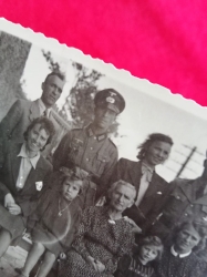 Photo from the Album of an SS Soldier and a WH Soldier with his family.