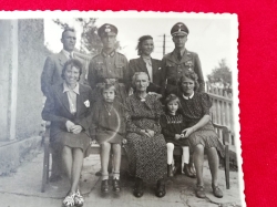 Photo from the Album of an SS Soldier and a WH Soldier with his family.