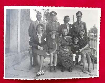 Photo from the Album of an SS Soldier and a WH Soldier with his family.