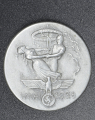 A 1938 National Day of Labour Badge maker marked Paul Schultze & Co..