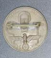 A 1934 National Day of Labour Badge maker marked.