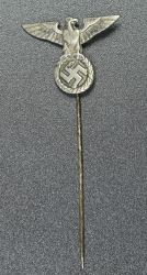 An NSDAP eagle stickpin marked GES.GESCH.