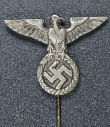 An NSDAP eagle stickpin marked GES.GESCH.