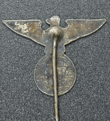 An NSDAP eagle stickpin marked GES.GESCH.