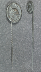 Set Wound Badge Black stickpins, one marked L/18 