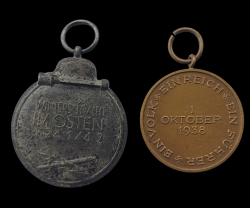 Two badges. Eastern Winter Campaign Medal and Commemorative Sudetenland Medal.