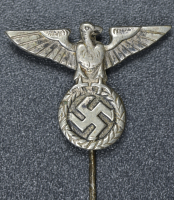 An NSDAP eagle stickpin marked GES.GESCH.