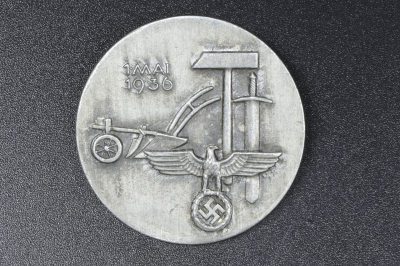 A 1936 National Day of Labour Badge maker marked.